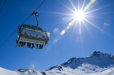 skiers in a chairlift