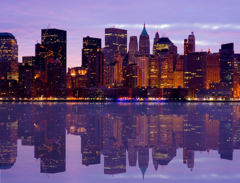 Early Morning Manhattan Skyline With Water Reflect