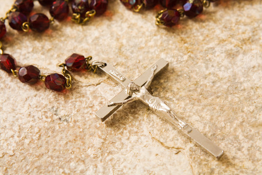 rosary beads on stone
