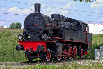 Fototapeta na wymiar old steam engine at station