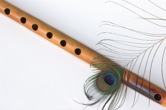 asian bamboo flute and peacock feather Stock Photo | Adobe Stock