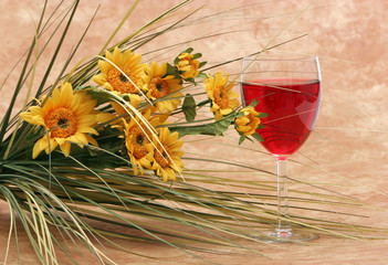 red wine and bunch of daisies