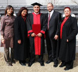 happy university graduate with his parents. international studen