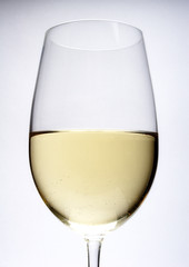 close up of white wine in glass