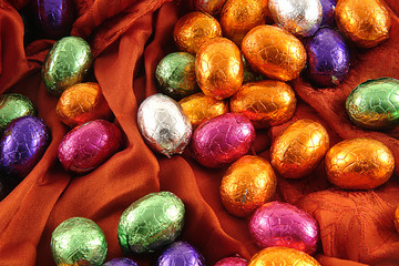 chocolate easter eggs on red background