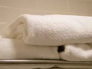 folded plush towels in a bathroom