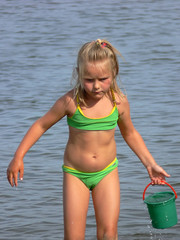 a girl playing on the beach