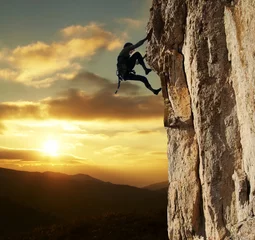 Fototapeten climber on sunset © Galyna Andrushko