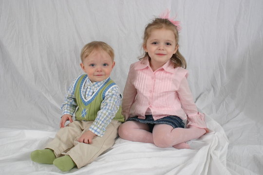brother and sister sitting together.