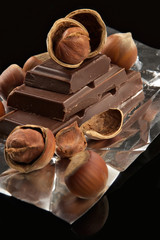 bitter dark chocolate in a foil and nuts