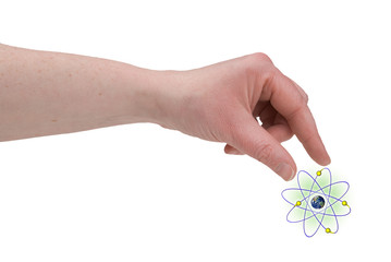 Fototapeta premium woman's fingers piching nucleus of an atom