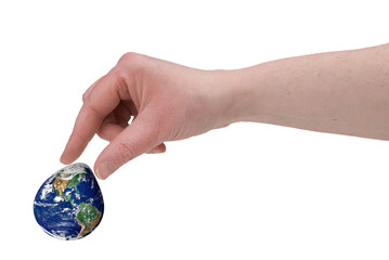 woman's fingers piching the earth