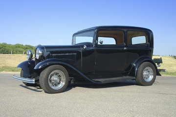 32 black sedan