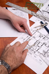 engineers, architects or contractors work on plans