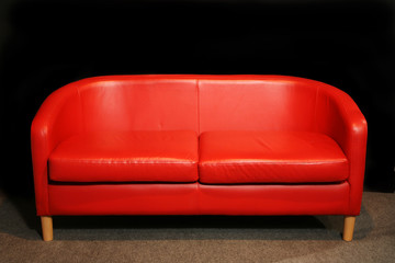 retro red sofa in dark room