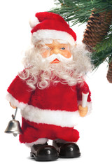 santa with a handbell in hands near a fur-tree