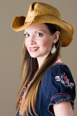 smiling brunette in western outfit