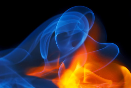 photo of fire with a smoke on a black background