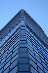 Fototapeta na wymiar angle view of a glass-windowed skyscraper