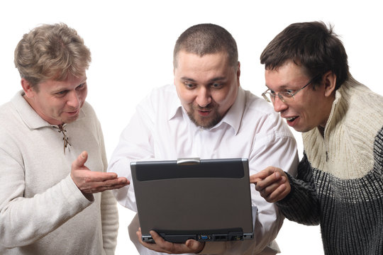 three men with notebook