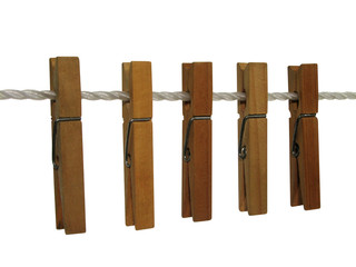 wooden clothespins on a clothes line (+ clipping path)