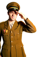 man in military field uniform with hat saluting