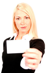 beautiful blonde business woman holding business card in front o