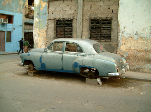 old car on bricks in havana, cuba.
