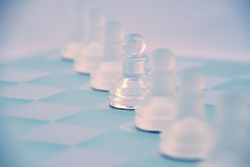 glass chess game diagonally set across board