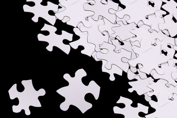 puzzle pieces on black
