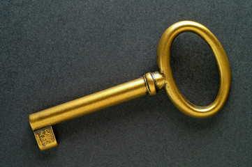 golden key over felt background