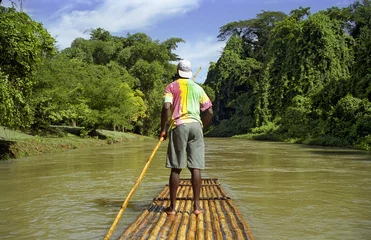 Fotobehang raft captain on calm river © David Biagi