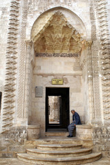 man near door og mosque