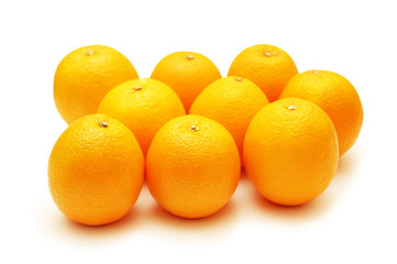 oranges arranged in rows and isolated on white