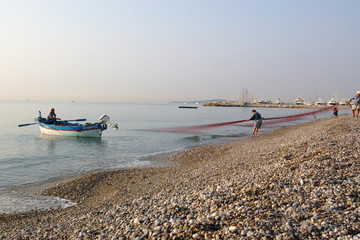 Obraz premium fishermans on a shore