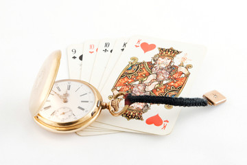 golden watch and playing cards as background