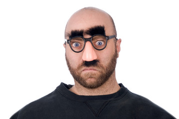 man wearing fake nose and glasses