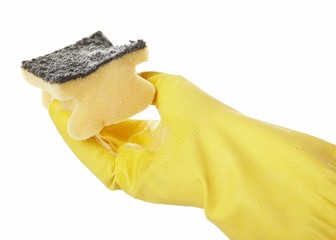 hand in yellow rubber glove with yellow sponge and