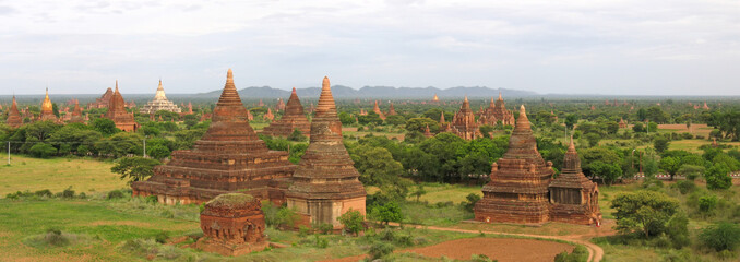 landscape of the valley at the sunset with the temples and stupa