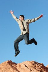 Obraz premium ecstatic businessman jumping