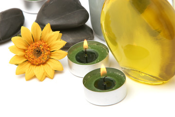 spa oil, daisy and candles