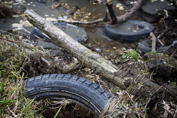 Fototapeta na wymiar old tires in a pile of garbage