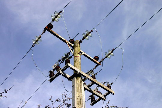 wooden electricity pole and wires