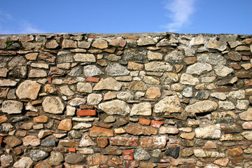 old stone wall and blue sky