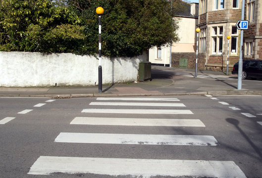 a british pedestrian zebra crossing.