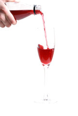 red liquid pouring into the glass