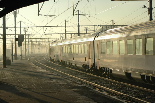 silver train in early morning fog