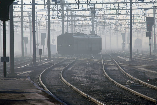 train in fog in brugges, belgium