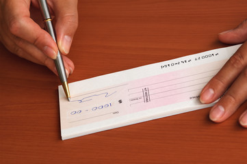 signing a money cheque