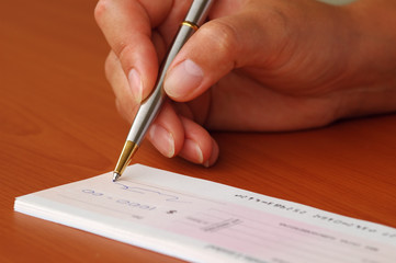 signing a money cheque